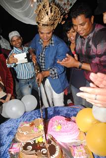 Siddharth Kumar Tewary cuts his birthday cake with a sword