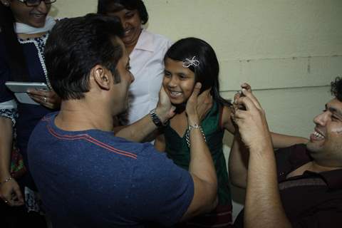 Salman Khan interacts with a child at the launch Thumps Up & Being Human Foundation's Veer Campaign
