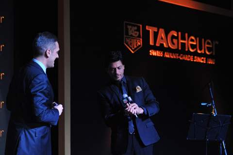 Shahrukh Khan tries on a watch at The Golden Era of the Carrera event by TAG Heuer