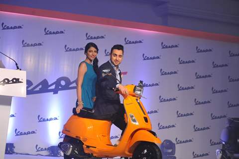 Imran Khan poses on the Vespa S with a fan