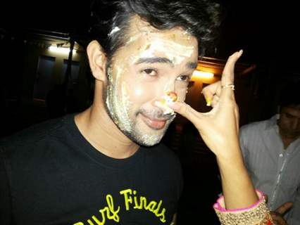 Karan Shrama's Birthday cake over his face