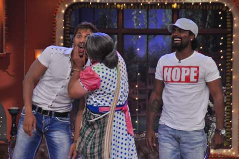 Dadi plants a kiss on Terence, while Remo watches this time