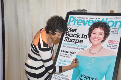 Manisha Koirala signs the cover of health magazine Prevention