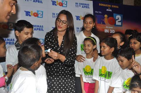 Sonakshi Sinha treats children to cake at a special screeing of Rio 2