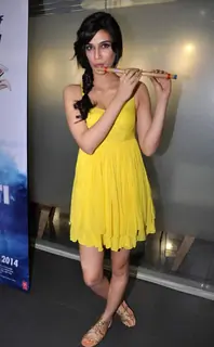 Kriti Sanon poses  with a flute at 'Whistle Bajja' song launch
