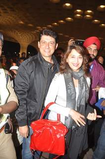 Madhuri Dixit and Dr. Shriram Nene at Mumbai airport leaving to attend IIFA