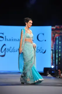 Tara Sharma walks the ramp at the 'Caring with Style' fashion show at NSCI