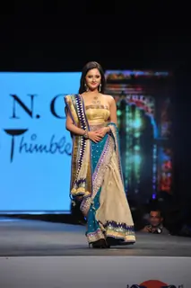 Rashmi Desai walks the ramp at the 'Caring with Style' fashion show at NSCI