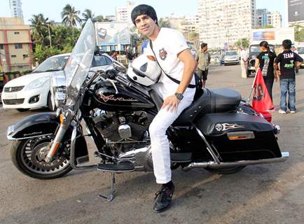 Arfi Lamba poses with a bike at The Fugly Bike Rally