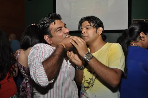 Ankit Tiwari feeding cake to Sujit Tiwari