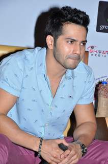 Varun engrossed in questions at the Press Meet