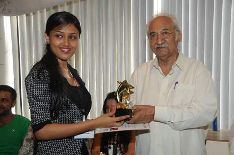 Pandhari Dada felicitating a Student