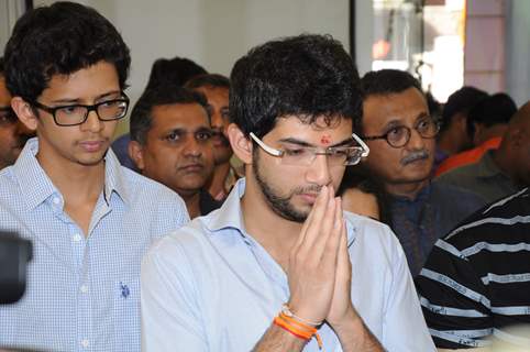 Aditya Thackeray praying before the lightning of the lamp