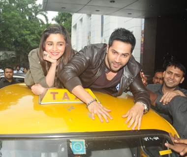 Varun Dhawan and Alia Bhatt take a ride on top of a cab at Kolkata