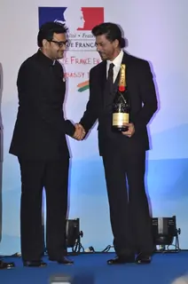 Shahrukh Khan felicitated with a champaign at the event