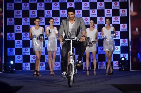 Sidharth Malhotra riding the bicycle at Taiwan Excellence launch