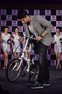 Sidharth Malhotra lifts the bicycle at the Taiwan Excellence launch