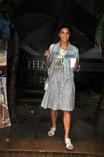 Jacqueline Fernandez poses for the media outside Starbucks