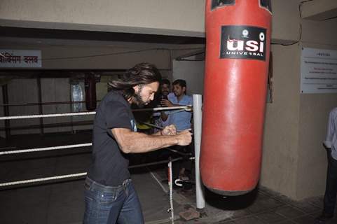 Akhil Kapur practices few punches on a punching bag at the Promotions of Desi Kattey