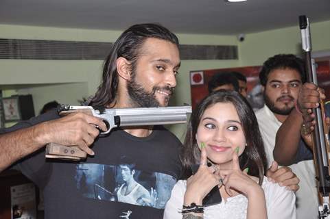 Akhil Kapur and Sasha Agha pose with a gun at the Promotions of Desi Kattey