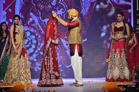 The bride and the groom garland each other at the IIJW 2014 - Day 2