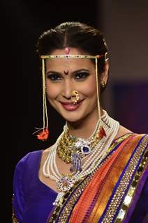 A model walks the ramp as a Maharashtrian bride at the IIJW 2014 - Day 2