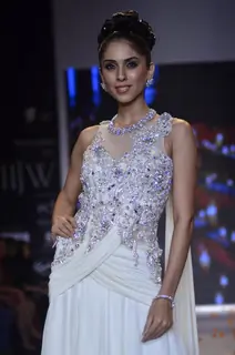 A model walks the ramp as a bride's maid at the IIJW 2014 - Day 2