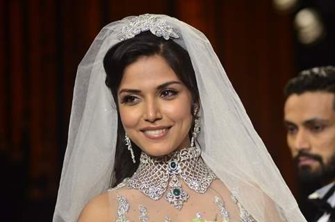 A model walks the ramp as a Christian bride at the IIJW 2014 - Day 2
