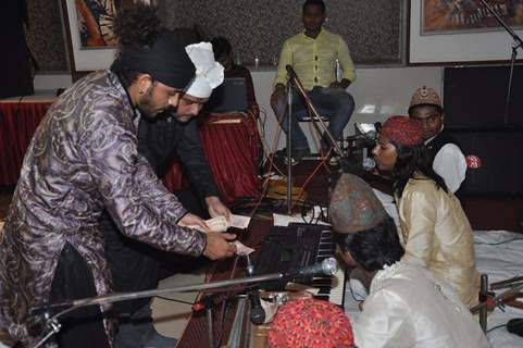 Sharib gives some money as a token of gratitude at the  Sufi Mehfil