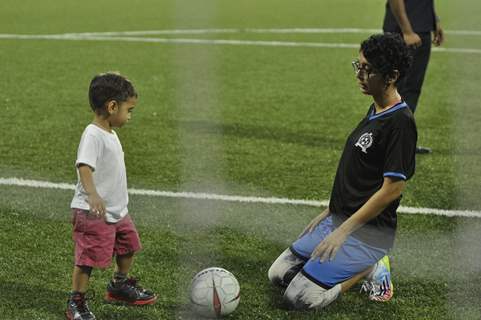 Azad playing football with his mom Kiran Rao at Charity Football Match