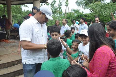 Dayanand Shetty seen giving autographs to his young fans at the Tree Plantation Drive