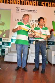 Sachin Tendulkar and Eugene Kaspersky pose with the autographed bat