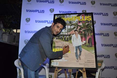 Rajeev Khandelwal signs his Autograph on the Travel Magazine Poster