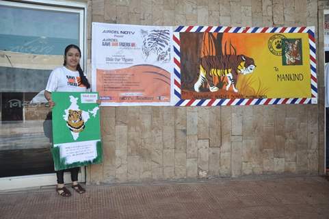 A Student holding the banner at NDTV Save The Tigers Contest