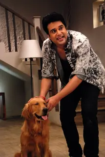 Krushna Abhishek pose with the Dog at the Promotion of It's Entertainment