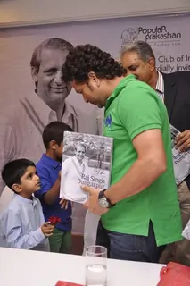 Sachin Tendulkar greets a young fan at Durgapur Tribute Book Launch