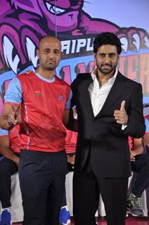 Abhishek Bachchan poses with a team member from his Kabbadi Team