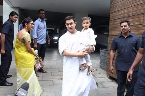 Aamir Khan spotted holding his son Azad outside his home