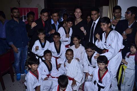 Tiger Shroff poses with the students