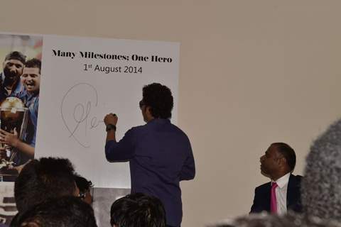 Sachin Tendulkar signs an autograph at the Inauguration of PVP Mall