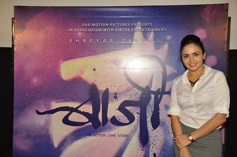 Amruta Khanvilkar poses with the poster of Baji at the First Look Launch