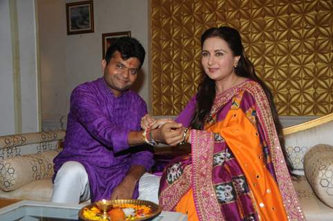 Poonam Dhillon ties a rakhi on her brother's hand for Raksha Bandhan