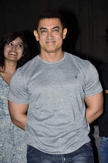 Aamir Khan gives a smiling pose for the camera at the Premiere of Saturday Sunday