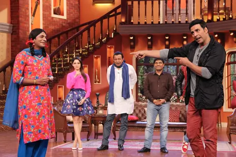 Akshay Kumar performs an act with Gutthi on Comedy Nights with Kapil