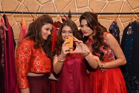 Parvathy Omanakuttan and Daisy Shah pose for a selfie with a fan