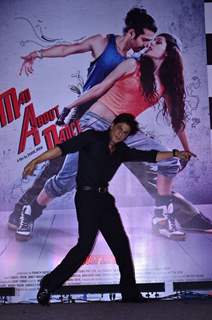 Shah Rukh Khan poses with the poster of Mad About Dance