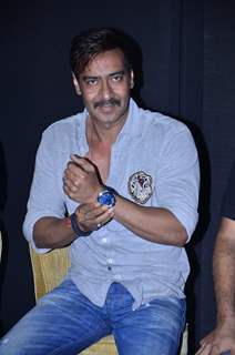 Ajay Devgn shows off her watch at the Promotions of Singham Returns