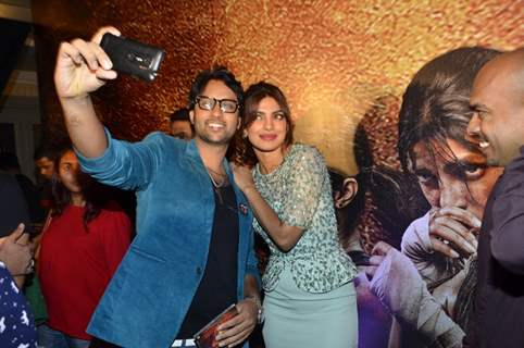 Prianka Chopra poses for a selfie with a fan at the Music Launch of Mary Kom