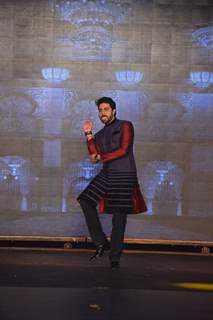 Abhishek Bachchan makes a funky pose while walking the ramp at Manish Malhotra's Show