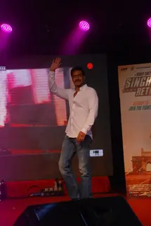 Ajay Devgn waves to the students at the Promotions of Singham Returns